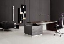 9 Black Office Desk Designs & How to Choose the Best one 204 exotic black marble office desk applied on the white modern ceramics floor it also has small black seat that can add the beauty of the house design ideas 9 Black Office Desk Designs & How to Choose the Best one - 203 Pouted Lifestyle Magazine