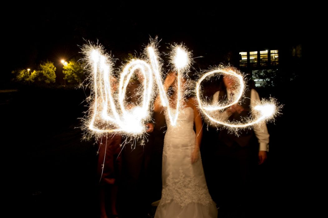 bride groom spell love with sparklers wedding reception