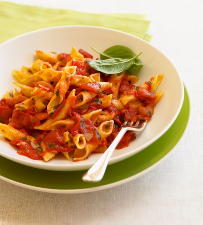 Bowl of penne pasta with tomato basil sauce