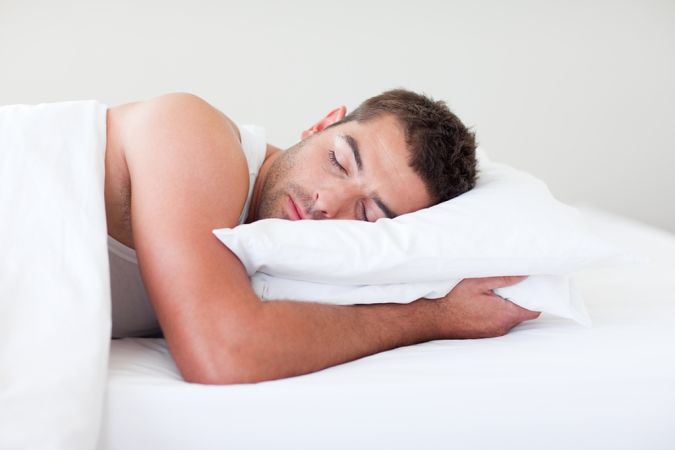 bigstock-Man-Sleeping-In-Bed