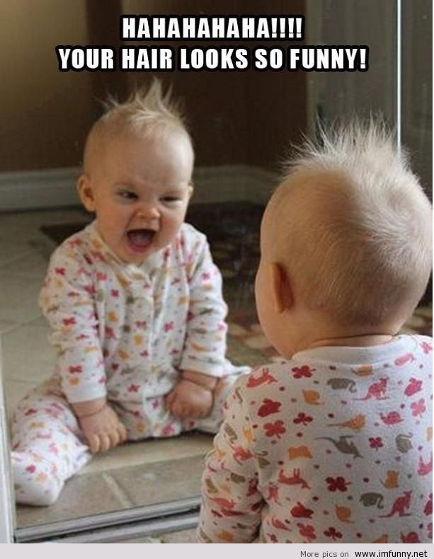 Funny-baby-looks-in-the-mirror