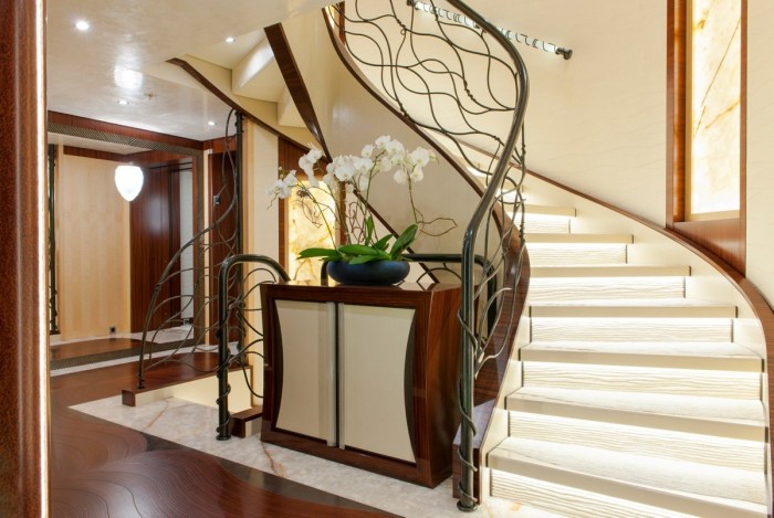 Make Your Home Look Like a Palace 5 a-grand-staircase-with-a-stylized-modern-banister-beckons-guests-toward-the-upper-levels-of-the-ship