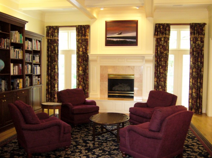 living-room-burgundy-chairs-navy-area-rug-floral-curtains-draperies-bookcase 8 Tips On Choosing A Carpet For Your Living Room