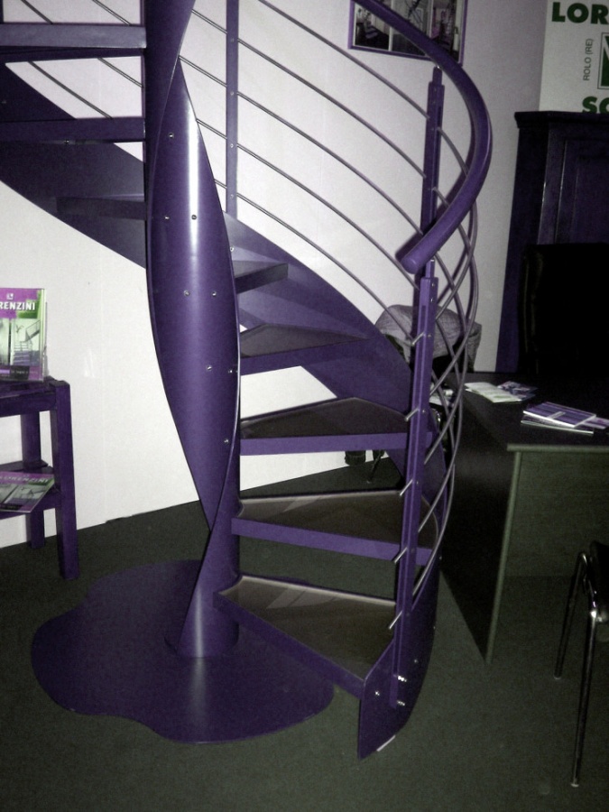 modern-staircase-design-with-a-circular-shape-made-of-iron-colored-purple-with-base-and-railing-touch-chrome-banisters-730x973 Turn Your Old Staircase into a Decorative Piece
