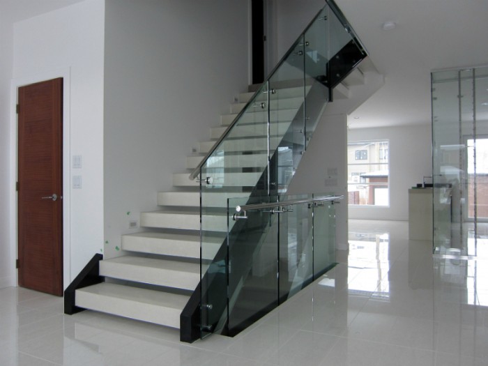 Decorate Your Staircase Using These Amazing Railings 17 white stairs with railing glass1