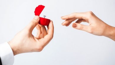 10 Simple & Cheap Engagement Gifts for Men 14 PW man handing over engagement ring to woman shutterstock 10 Simple & Cheap Engagement Gifts for Men - 2