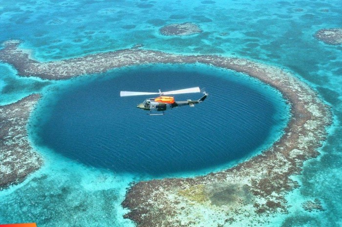 Weird Blue Holes That Are Magnets for Divers Around the World 17 Belize-BLUE-HOLE-Helicopter-Portofino