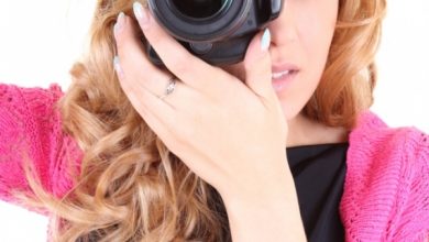 Woman with digital camera Easy to Follow Tricks & Secrets for Taking Better Digital Photographs - 13