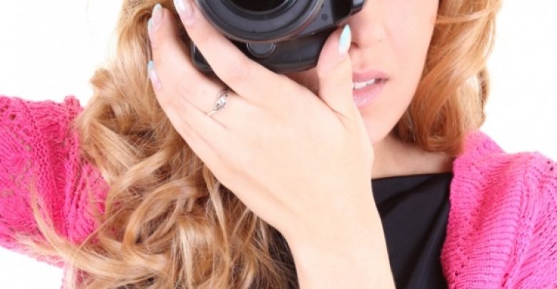 Woman with digital camera Easy to Follow Tricks & Secrets for Taking Better Digital Photographs - taking photographs 1