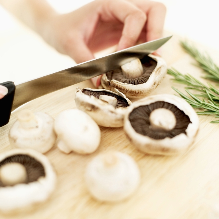 cutting-mushrooms 10 Types of Food to Provide You with Longevity & Good Health