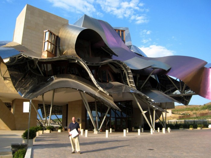 Hotel Marqués de Riscal It is situated in Rioja alavesa, Spain. This fascinating hotel with its colorful titanium canopies that take the shape of ribbons consists of two sections with 43 rooms. The two sections of the hotel are connected to each other with a footbridge. The fabulous ribbons are not only used as decorative pieces, but they are also function as sunshades.