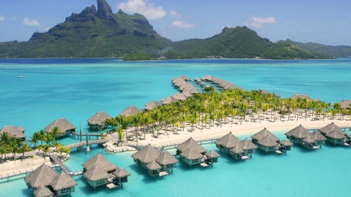 Bora Bora It is one of the most famous honeymoon destinations that attracts many couples from different areas around the world. It is located in French Polynesia. The fascinating tropical nature will dazzle you and you can enjoy its blue and clear waters with the ability to have dinner on its white-sand beaches.