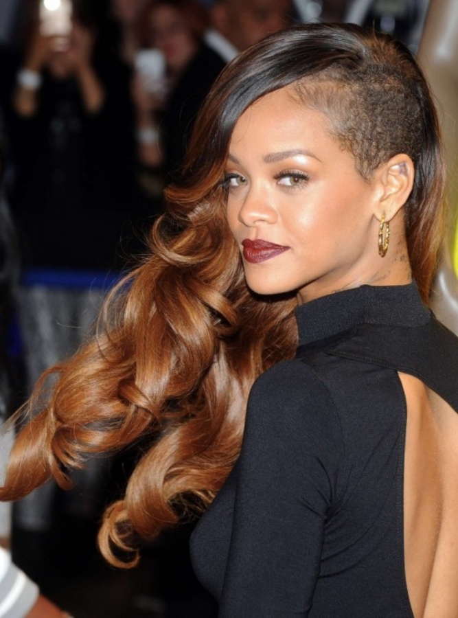 Rihanna with her mullet hairstyle that looks scary as her head is shaved from both sides.