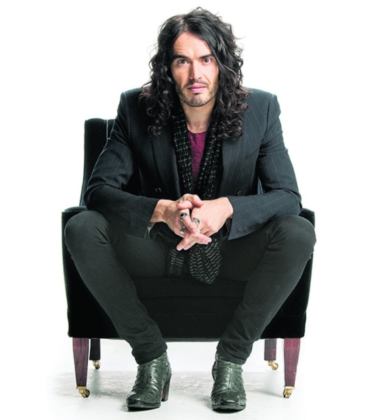 Russell Brand with his long black hair