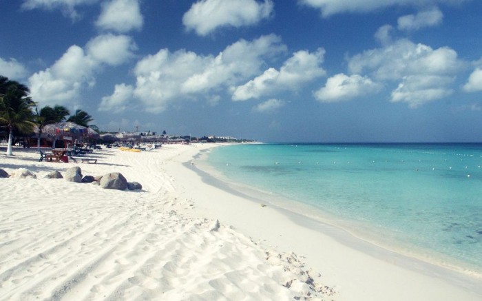 Aruba It is located in the southern Caribbean Sea. Its warm and sunny weather, white-sandy beaches, calm waters and breathtaking beauty have made it one of the major honeymoon destinations around the world. 