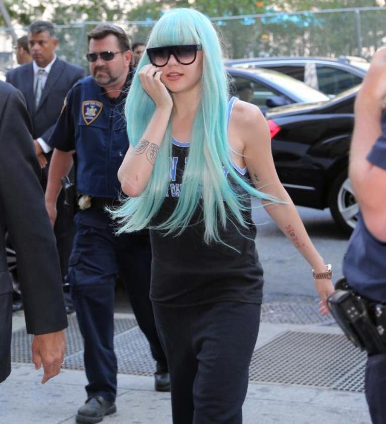 Amanda Bynes with her long hair and its strange color