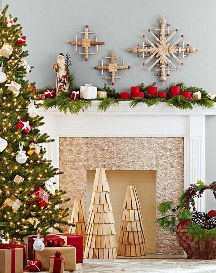 diy-wooden-christmas-tree-replicas-and-handmade-snowflakes-adorn-the-fireplace 65+ Dazzling Christmas Decorating Ideas for Your Home in 2020