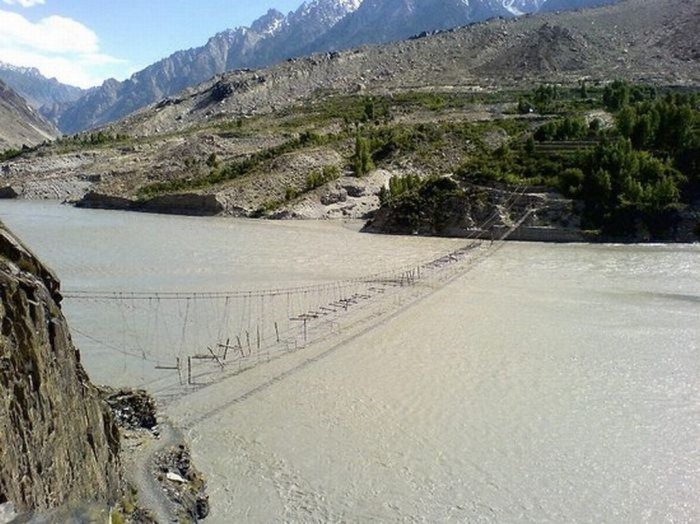 Hussaini Hanging Bridge It is built in Hussaini village, Pakistan to cross over the Hunza River. It was submerged before in May 2010. 