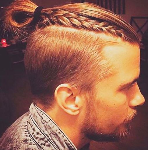 A-photograph-of-a-handsome-blonde-male-with-a-man-bun-undercut-hairstyle-and-some-of-his-long-hair-braided