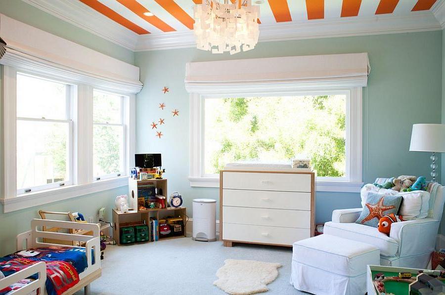 a-fascinating-childs-room-with-cool-blue-wall-and-armchair-also-tasty-orange-stripe-ceiling-with-colorful-bedding-and-toys-shelf-also-charming-chandelier