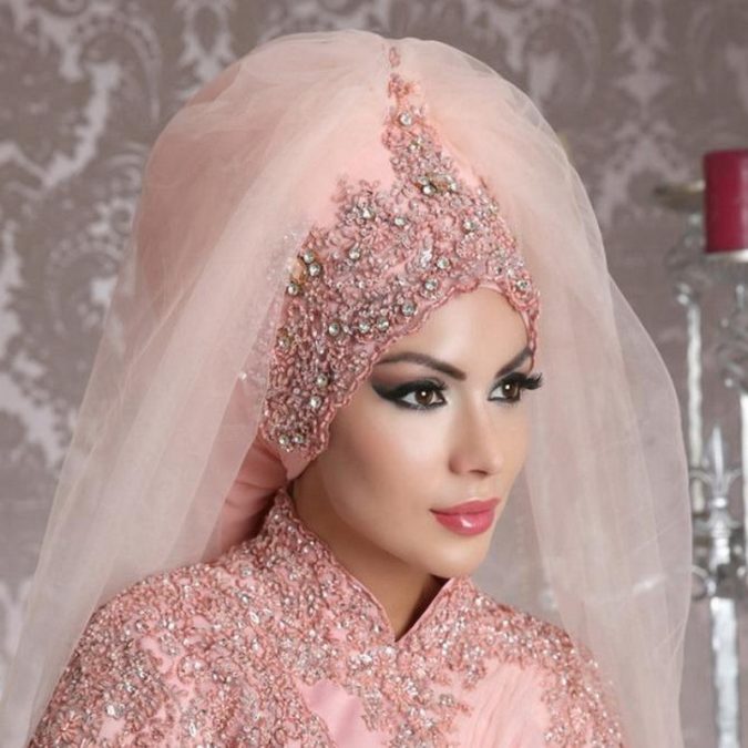 Muslim bride in pink wedding dress 5 Stylish Muslim Wedding Dresses Trends - 16