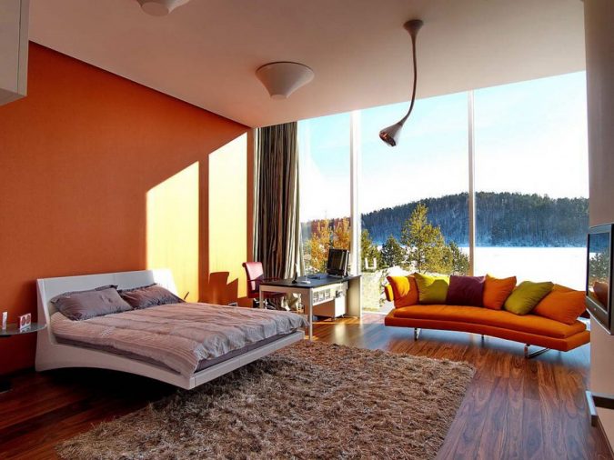 orange bedroom with glass walls