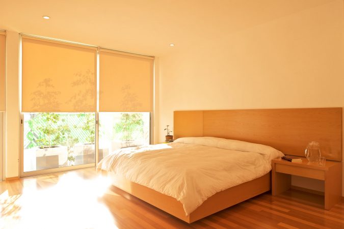 orange bedrooms with large windows