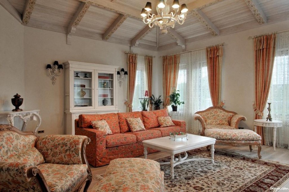 Graceful living room decoration ideas with orange floral pattern sofa and fancy chandelier above white table including white brown floral rug as well wooden ceiling and striped curtain 20+ Hottest Curtain Design Ideas - 67
