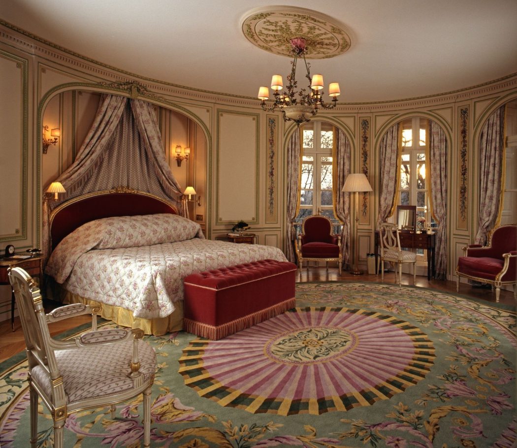 10 Ways to Add Glam to Your Hollywood Home 2 black metal chandelier on the ceiling connected cream bed on with the most amazing master bedroom chandelier intended for really encourage 10 Ways to Add Glam to Your Hollywood Home - 2