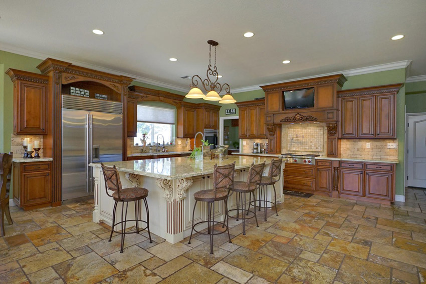 6 Affordable Organizing and Decoration Ideas for your Kitchen 23 traditional kitchen with rustic cabinetry large island and travertine floor tiles 6 Affordable Organizing and Decoration Ideas for your Kitchen - 23