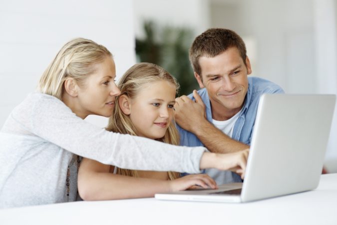 Parents Kids using laptop Top 10 Exclusive Tips to Find Cheapest Hotel Deals - 3