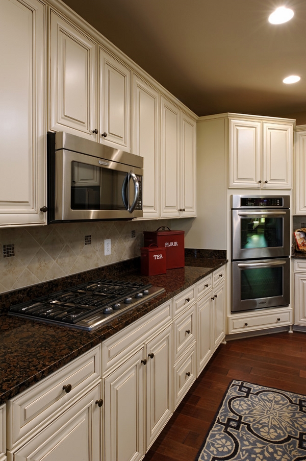 white kitchen with dark surfaces 2 Top 10 Best White Bright Kitchen Design Ideas - 9