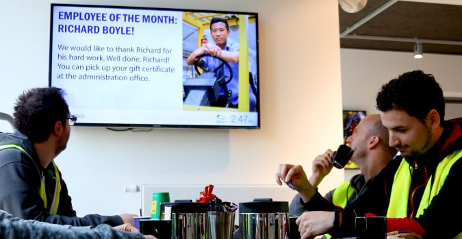 7 Reasons Digital Signage Gets Your Business More Customers 11 digital signage industrial cargoco employee 7 Reasons Digital Signage Gets Your Business More Customers - 11