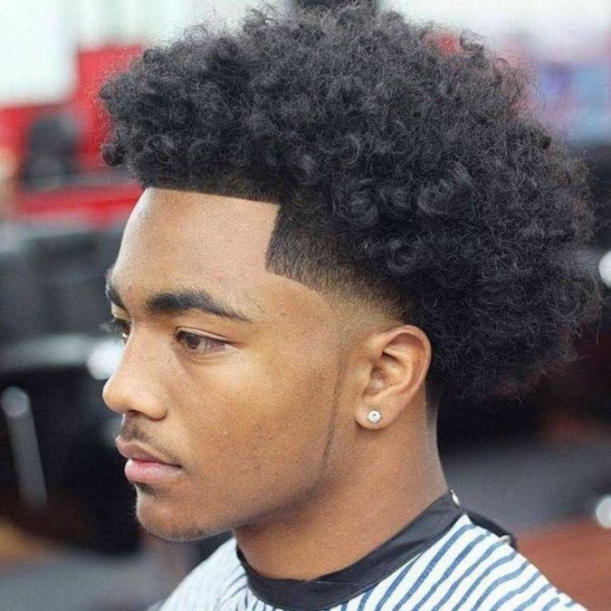 men hairstyles comb faded temples and long curles 7 Craziest Curly Hairstyles for Black Men - 4