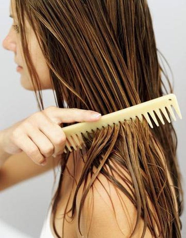 a woman brushing her wet hair mayonnaise honey hair treatment Top 10 Best Hair Masks for Color Treated Hair - 14