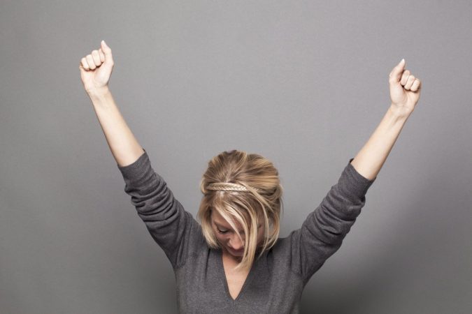 confidence woman raising her hands 3 Steps Towards Living the Life You Want! - 9