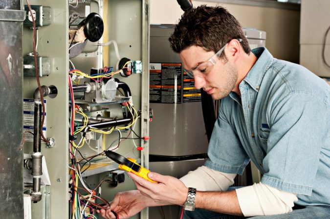 furnace-Technician-heating-wiring-675x449 Top 10 US Areas Need Furnace Repair services