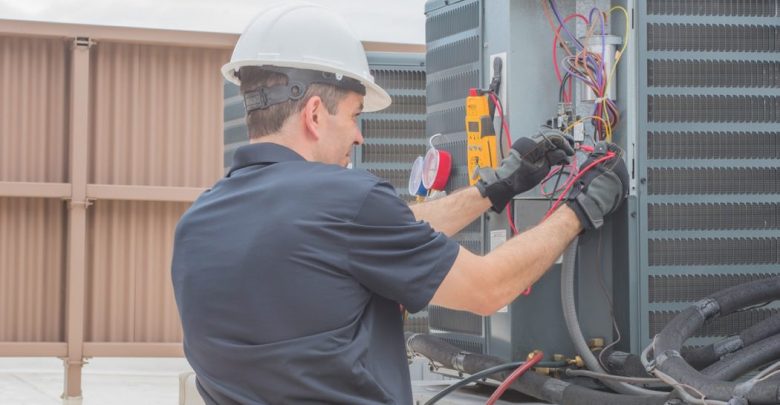 furnace technician working on heat pump Top 10 US Areas Need Furnace Repair services - Furnace Repair services 47