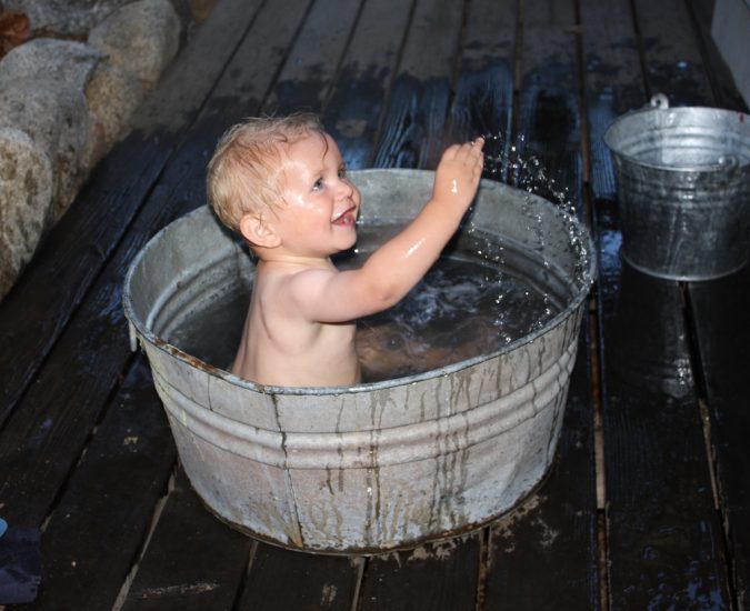 child-bathing-in-a-bucket-675x550 The Truth about Bathing throughout the Years [+500 Years Bathing History]