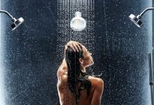 showering in a modern bathroom The Truth about Bathing throughout the Years [+500 Years Bathing History] - 152 Pouted Lifestyle Magazine