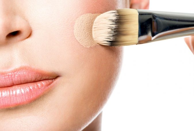 applying makeup foundation with brush 5 Simple Tips to Avoid Cakey Makeup - 7