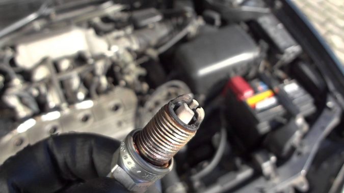 fix-car-Replacing-Spark-Plugs-675x380 What Car Issues You Can Fix with AutoZone Tool Rental