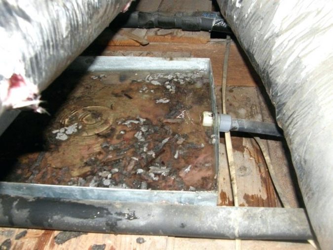 air-conditioner-rusted-condensation-drain-pan-675x506 Fast Repairs for Leaking Central Air Conditioning Systems