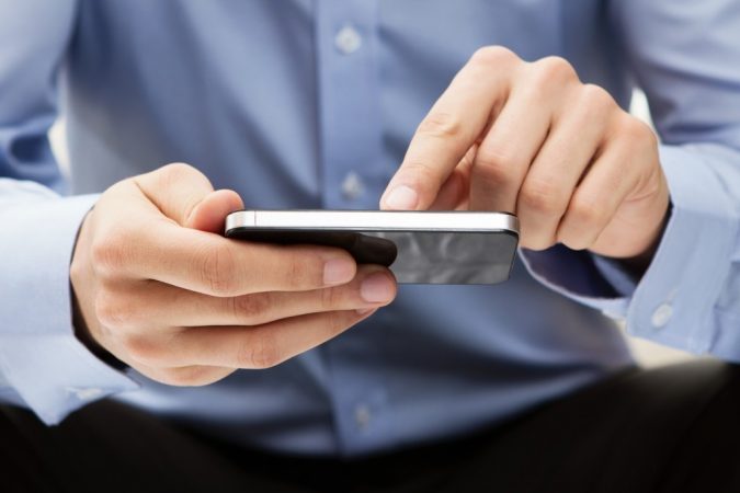 using smartphone 2 Top 7 Main Tools to Start Your Online Shop - 8