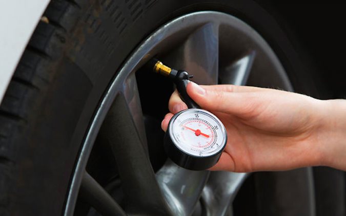 checking the car Tires 10 Essential Car Maintenance Tips That You Should Know - 7
