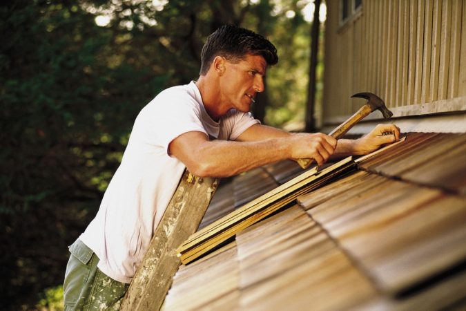 fixing home man reparing home roof DIY How to Prep for a Successful Home Walk-Through with Ease - 2