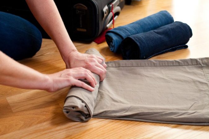 travel packing clothes rolled 10 Packing Essentials Tips for Your Next Adventure Holiday - 9