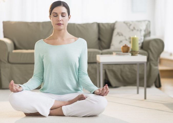 Meditation-on-carpet-at-home-675x482 Holistic Ways to Fight Stress and Find Peace