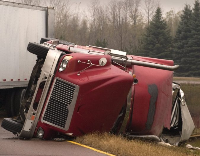 truck-accident-CommercialTruckFlippedOver-675x527 What Can a Semi Truck Accident Lawyer Do for You?