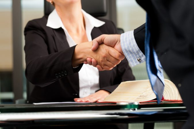lawyer-and-client-handshake-675x450 How to Handle an Insurance Company’s First Settlement Offer after a Car Accident